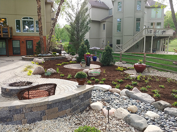 Landscape installation in Lee's Summit including plants and hardscaping from Evolving Landscapes