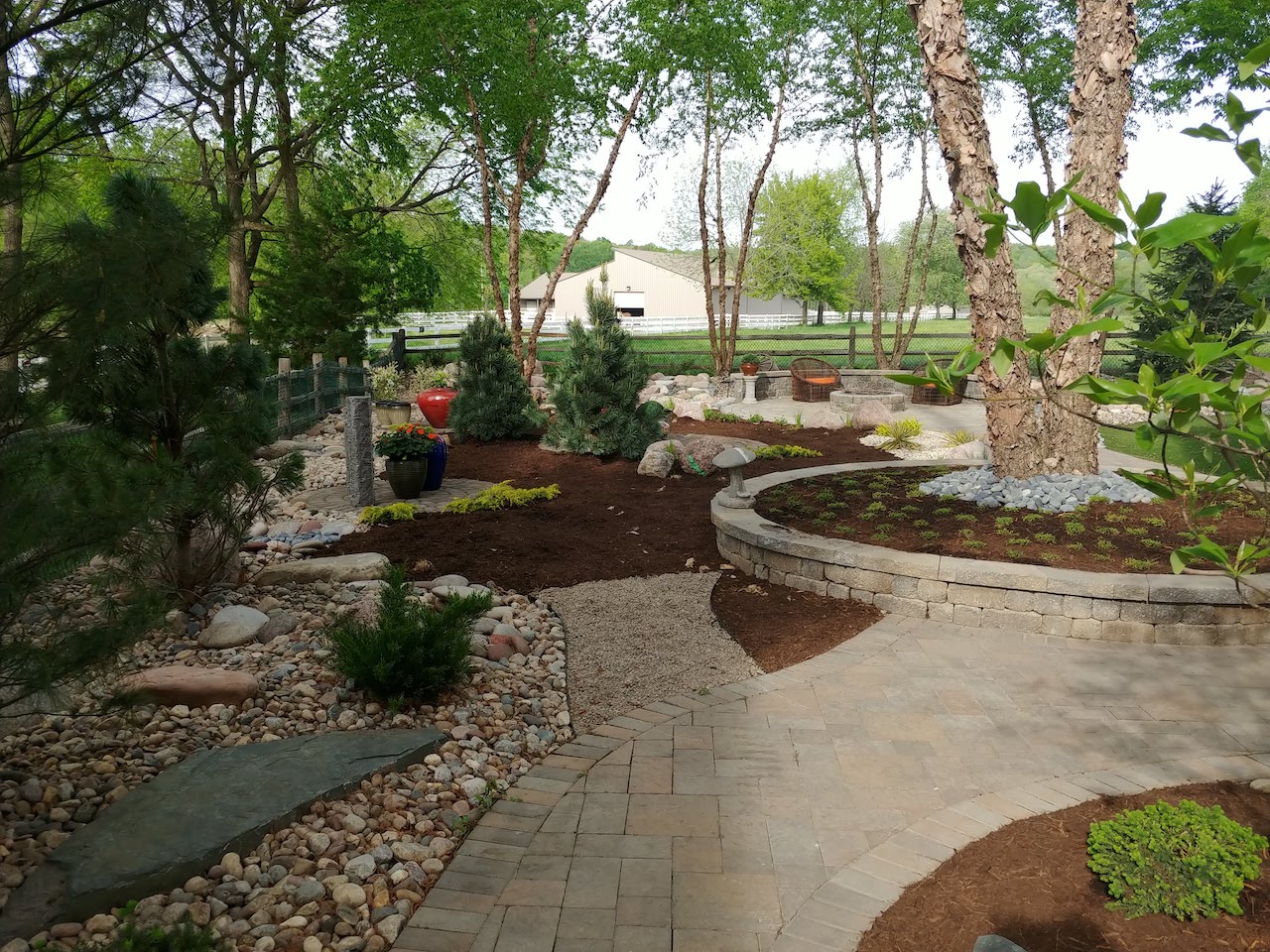 Plant and hardscape landscape architecture mix by Evolving Landscapes in Lee's Summit, MO