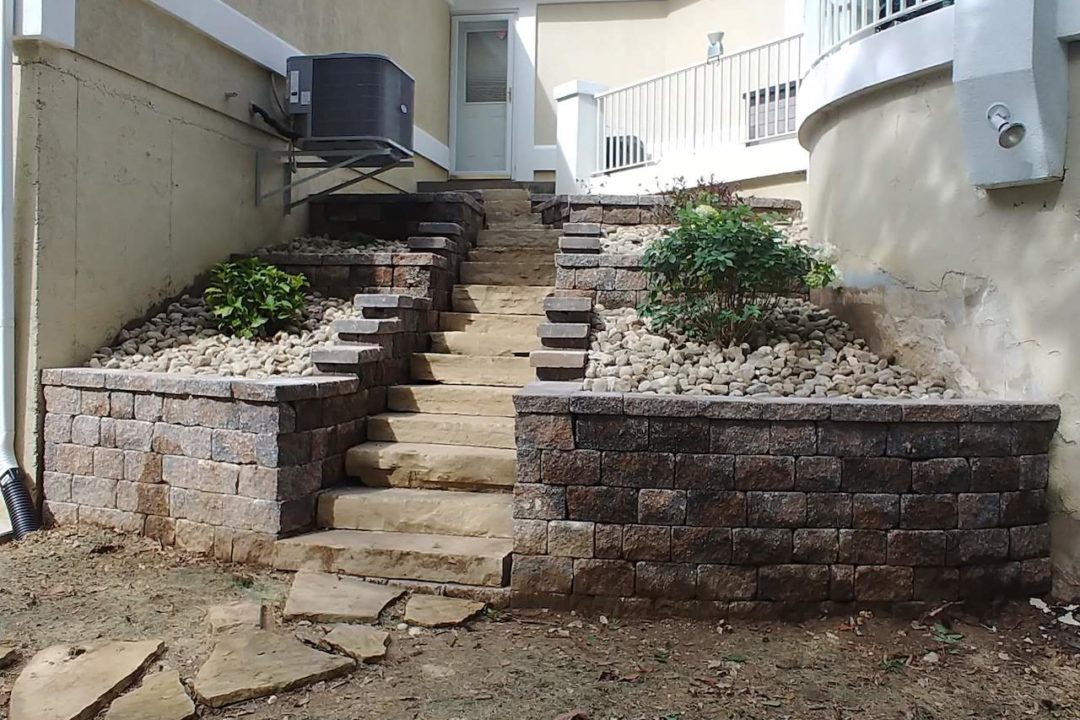 Stone steps and retaining wall by Evolving Landscapes in Lee's Summit, MO