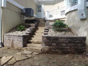Stone steps and retaining wall by Evolving Landscapes in Lee's Summit, MO